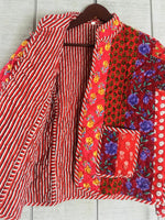 Load image into Gallery viewer,  Boho quilted jacket detail view highlighting traditional hand-printed textiles and artisan craftsmanship

