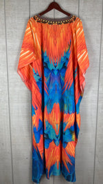 Load image into Gallery viewer, Orange and blue feather print caftan close-up showing V-neck embellishments and flowing batwing sleeves
