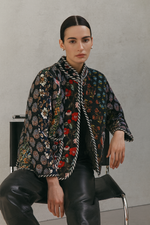 Load image into Gallery viewer, Reversible black cotton patchwork jacket laid flat displaying unique handcrafted vintage design and contrasting trim
