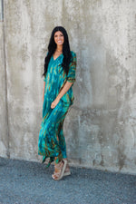 Load image into Gallery viewer, Woman wearing teal green kaftan dress with pockets -
